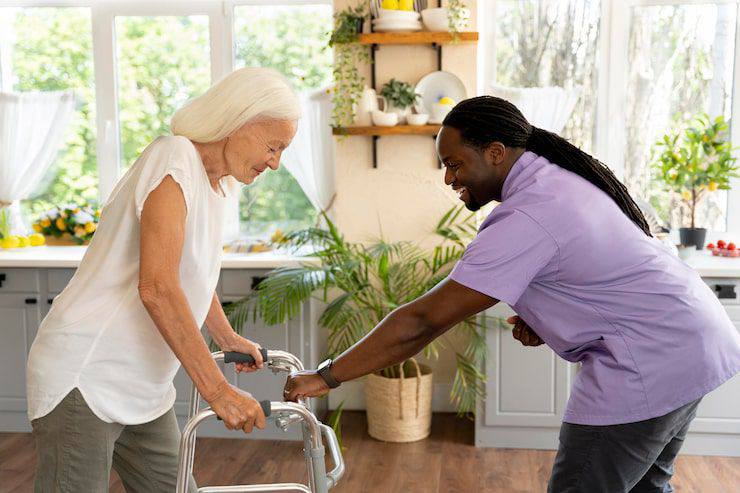 Caregiver helping with walker